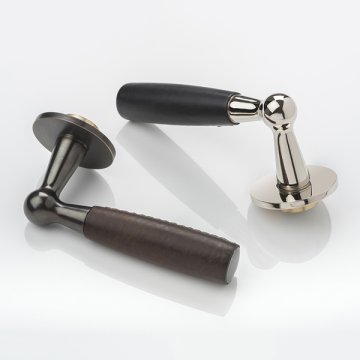 Bennett solid brass door lever handle with hand stitched leather & round rose