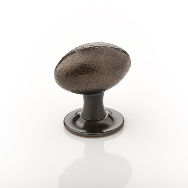 Intricately hammered solid brass oval door knob with tapered rose