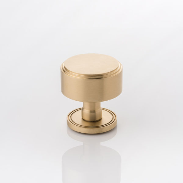 Bartlett II solid brass door knob with grooved rose