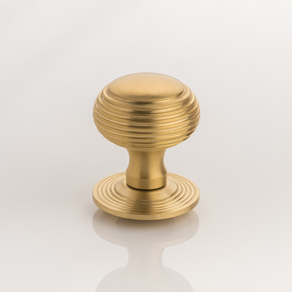 Berenice solid brass door knob with reeded rose