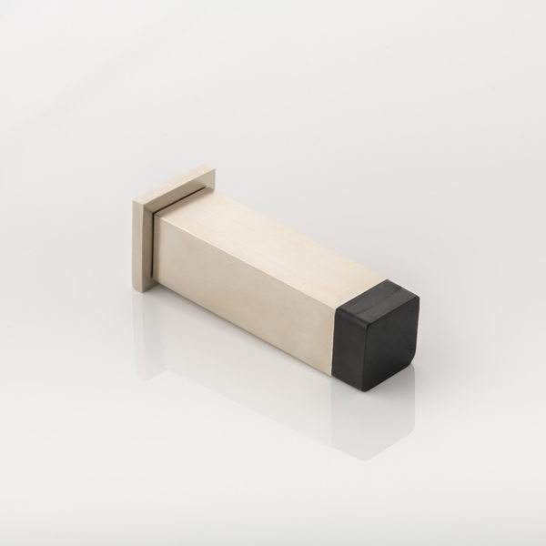 Cube II solid brass wall-mounted door stopper with decorative stepped plate