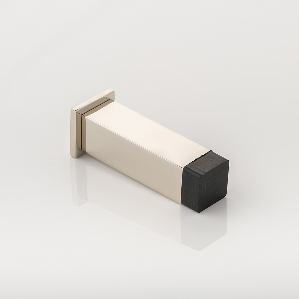 Cube II solid brass wall-mounted door stopper with decorative stepped plate