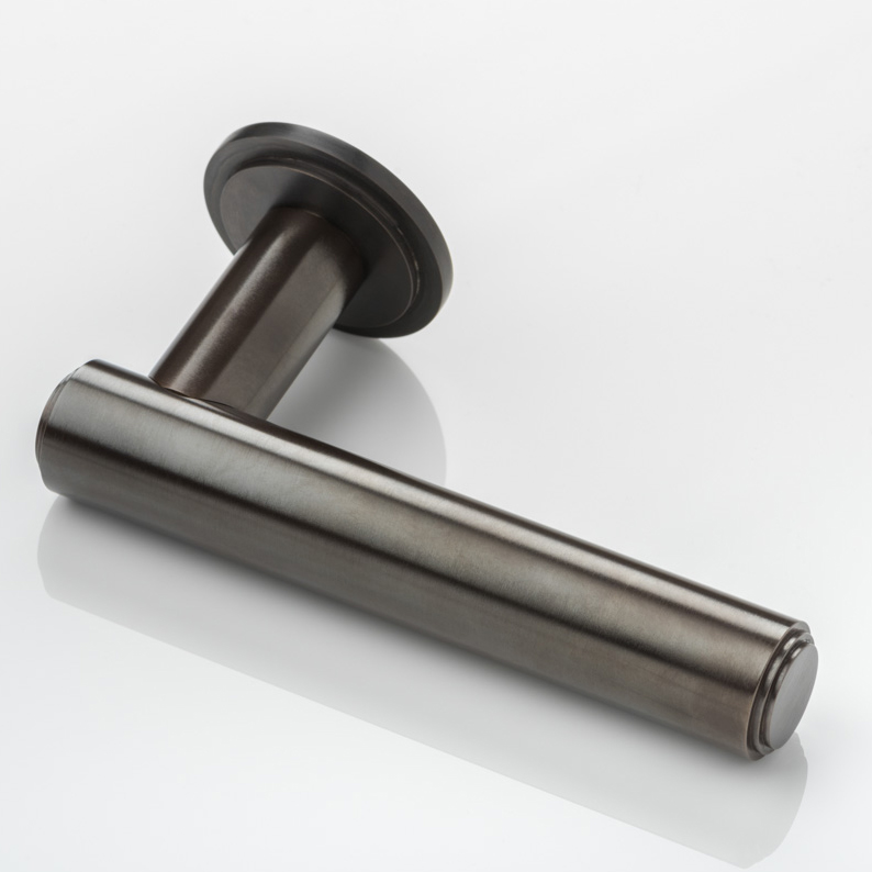 Bartlett solid brass door lever handle with round stepped rose