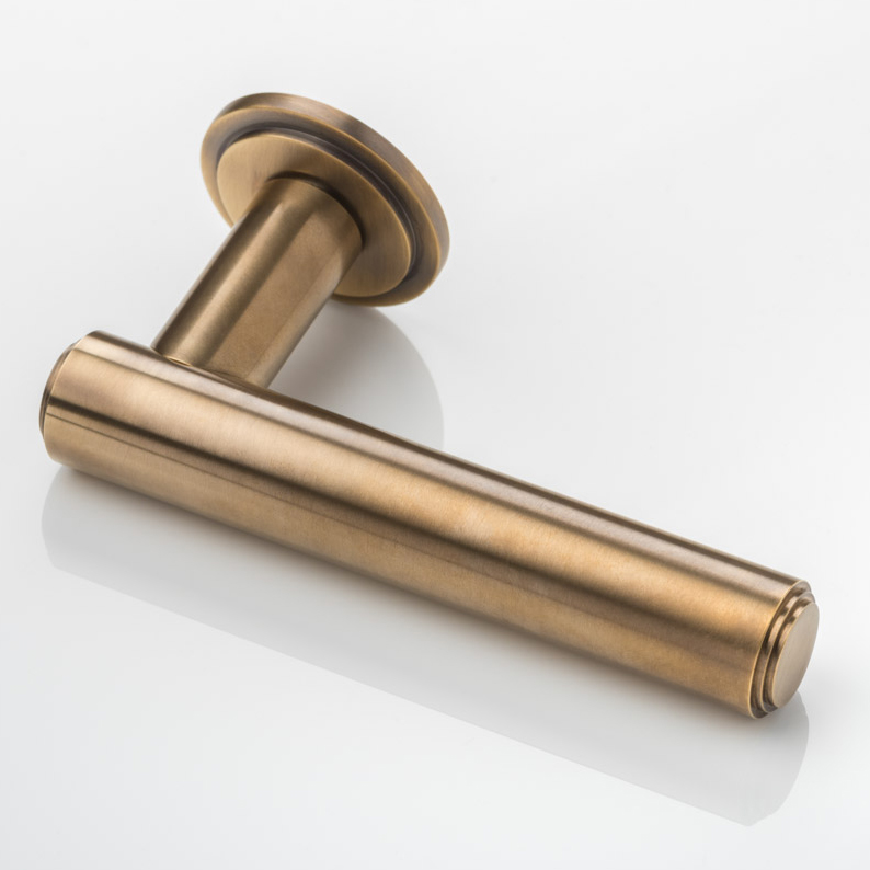 Bartlett solid brass door lever handle with round stepped rose
