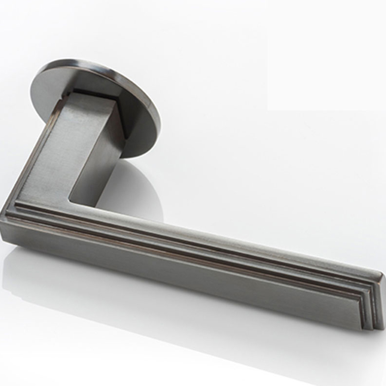 Dewhurst III solid brass door lever handle with round rose