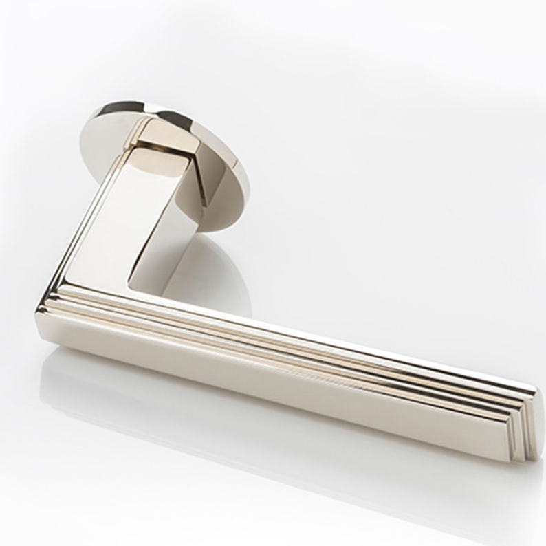 Dewhurst III solid brass door lever handle with round rose