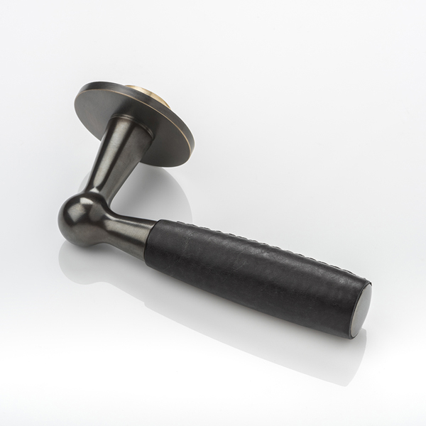 Bennett solid brass door lever handle with hand stitched leather & round rose