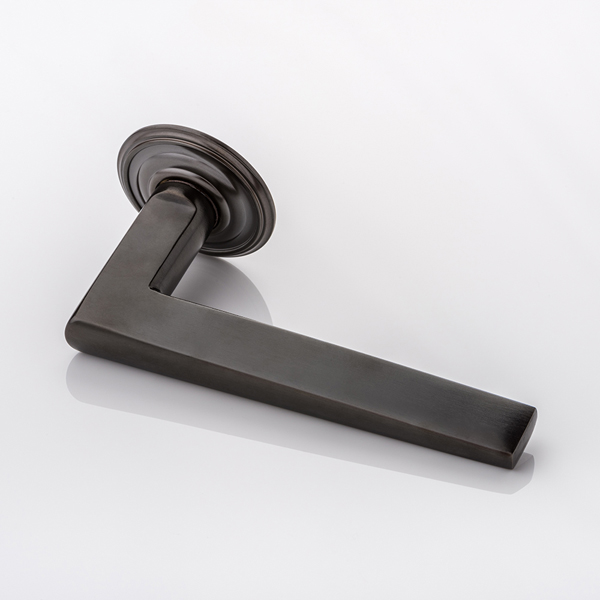 Wedge II solid brass door lever handle with ornate rose