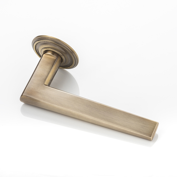 Wedge II solid brass door lever handle with ornate rose