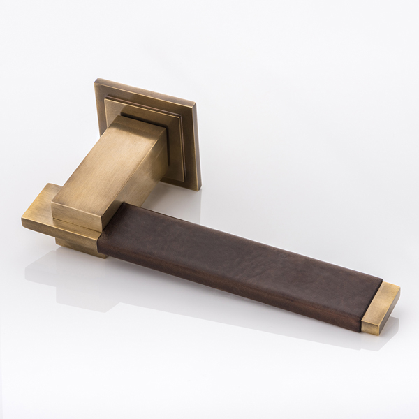 Holmes II solid brass door lever handle with hand stitched leather & square stepped rose