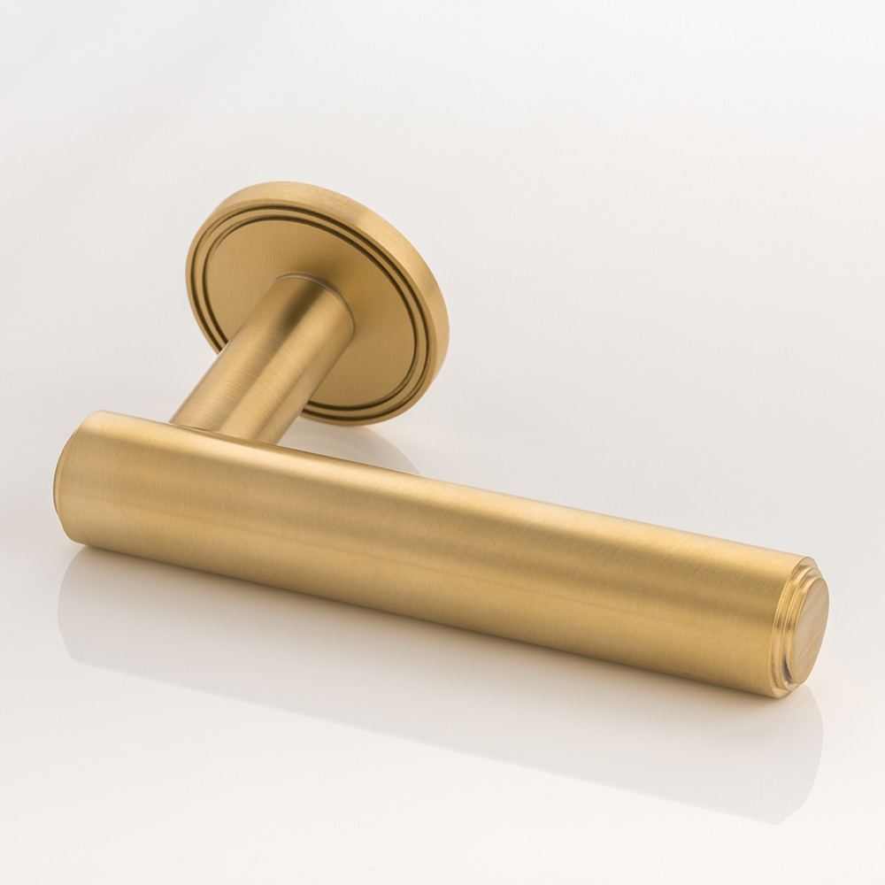 Bartlett II solid brass door lever handle with grooved rose