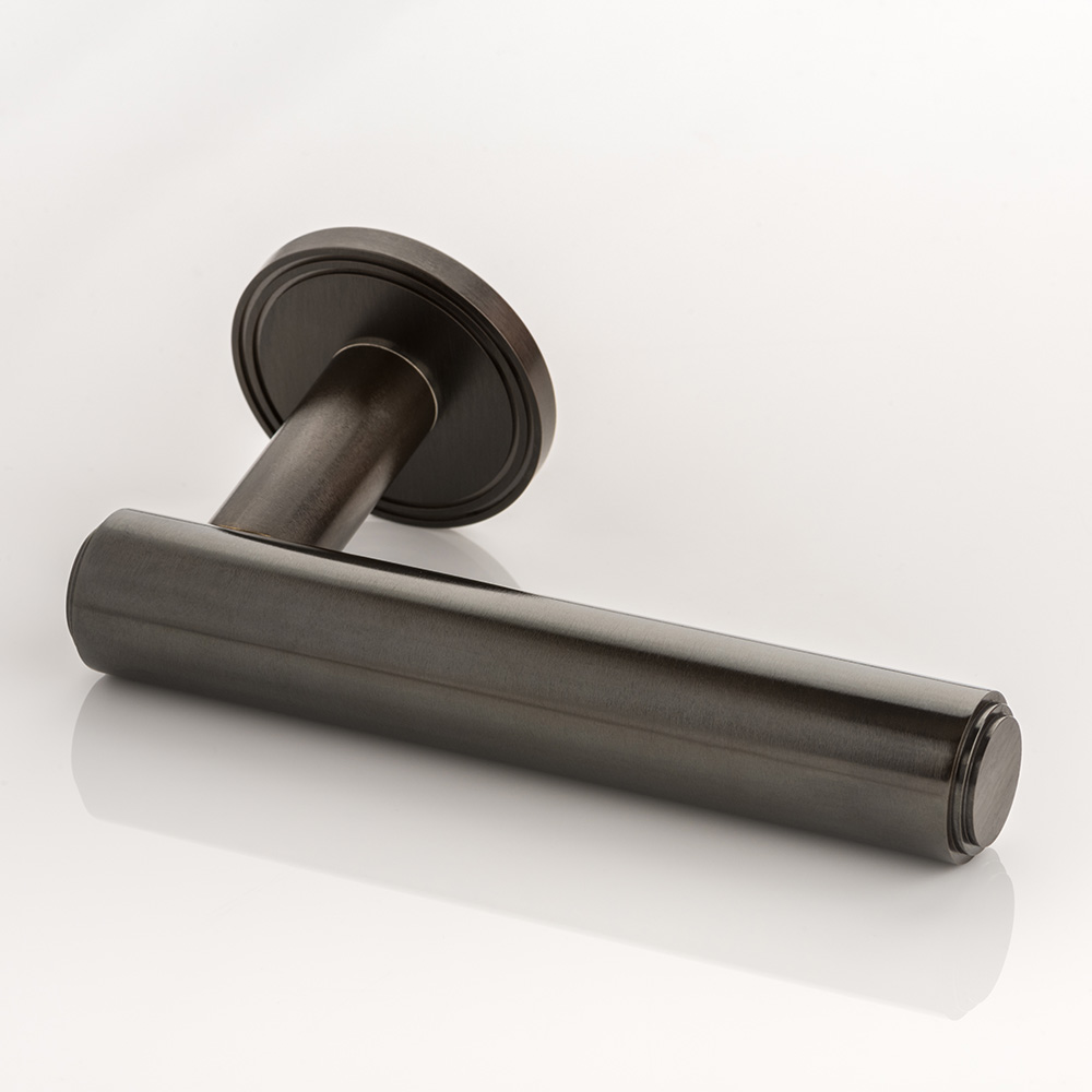 Bartlett II solid brass door lever handle with grooved rose