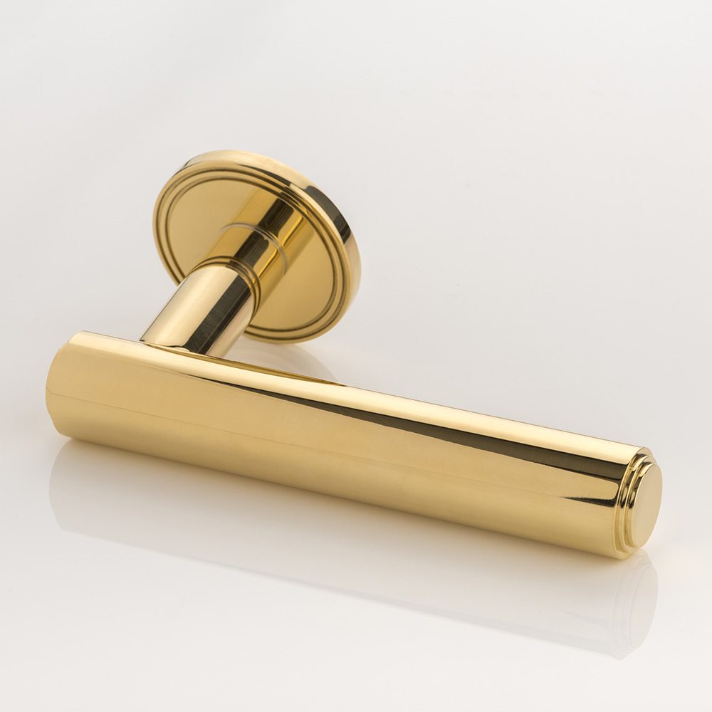 Bartlett II solid brass door lever handle with grooved rose
