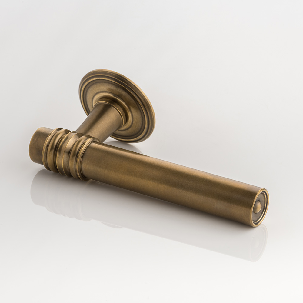 Remmington solid brass door lever handle with ornate rose