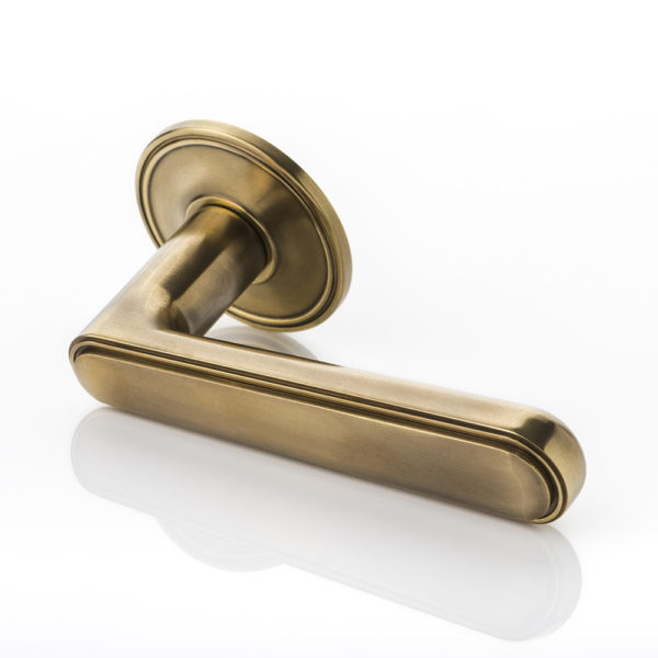 Halsey II solid brass door lever handle with ridged rose