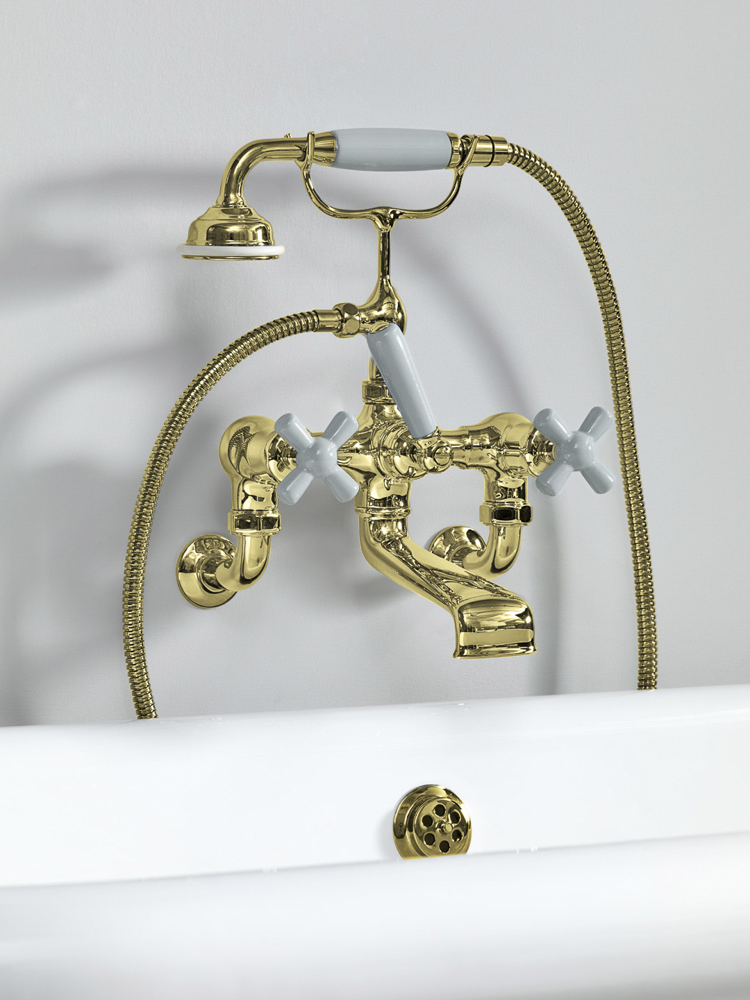 Rockwell wall-mounted bath mixer with handshower & metal/coloured crosshead taps