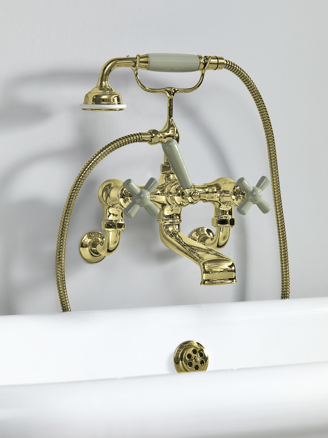 Rockwell wall-mounted bath mixer with handshower & metal/coloured crosshead taps