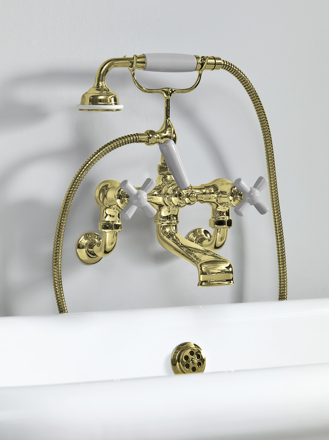 Rockwell wall-mounted bath mixer with handshower & metal/coloured crosshead taps