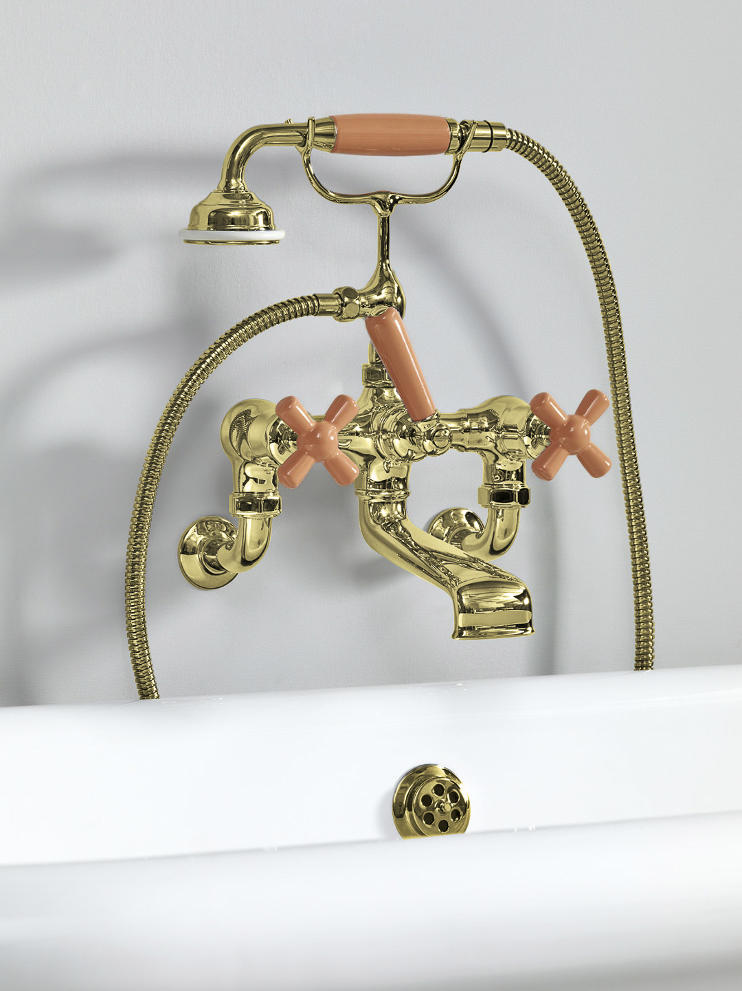 Rockwell wall-mounted bath mixer with handshower & metal/coloured crosshead taps