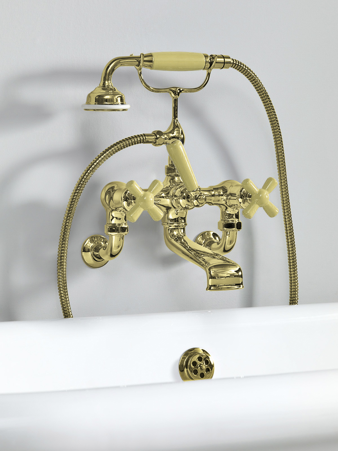 Rockwell wall-mounted bath mixer with handshower & metal/coloured crosshead taps
