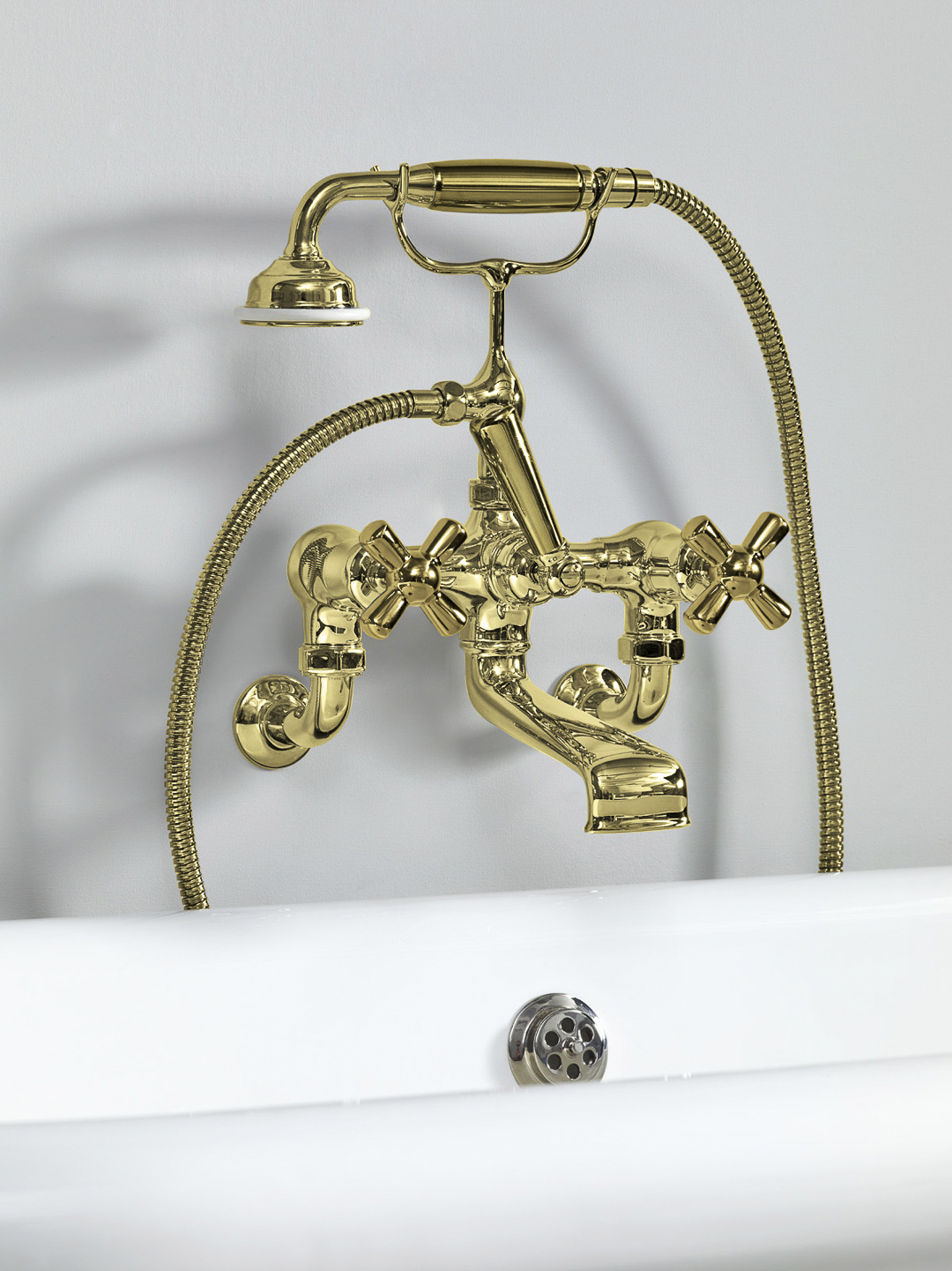 Rockwell wall-mounted bath mixer with handshower & metal/coloured crosshead taps