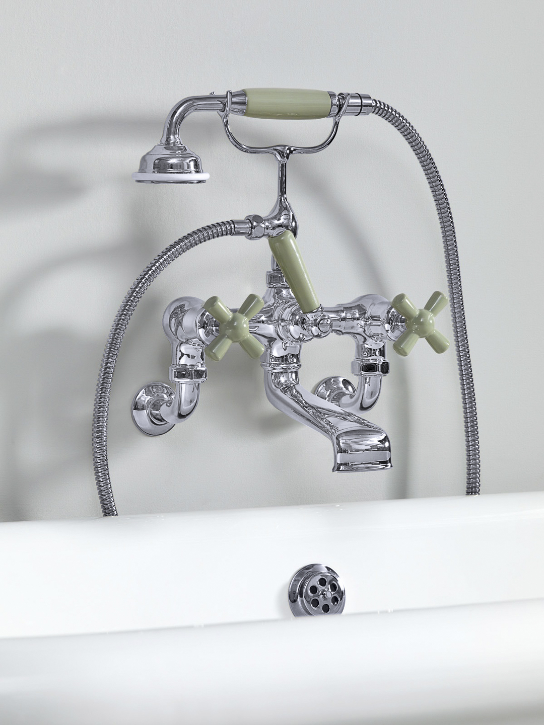 Rockwell wall-mounted bath mixer with handshower & metal/coloured crosshead taps