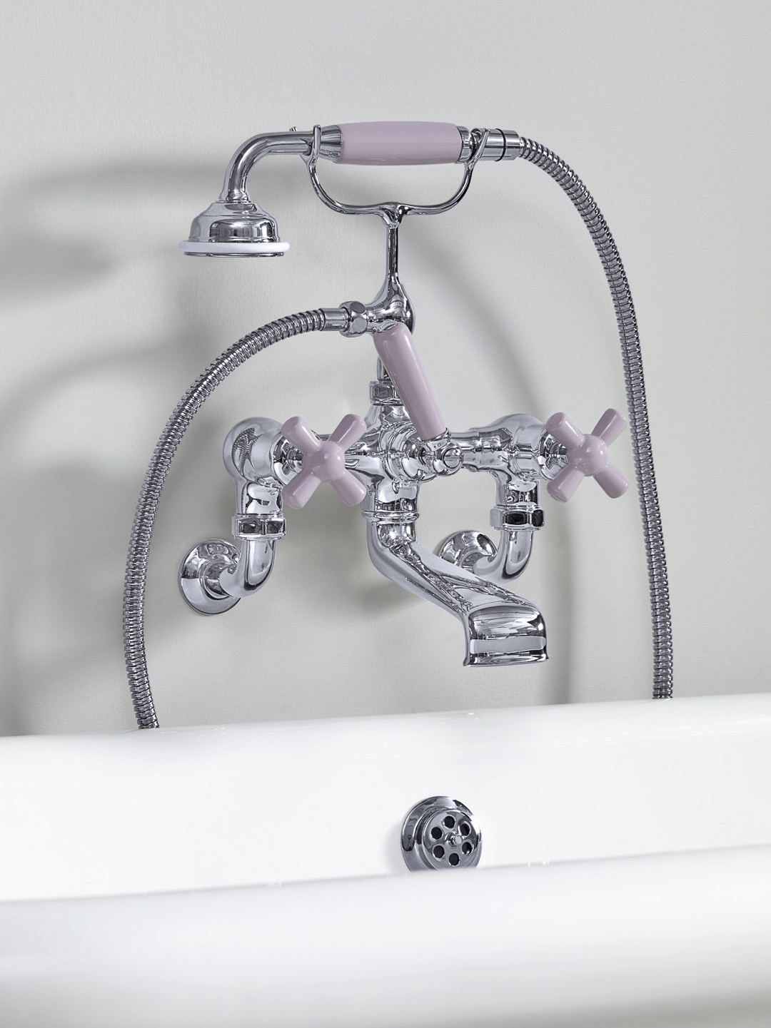 Rockwell wall-mounted bath mixer with handshower & metal/coloured crosshead taps