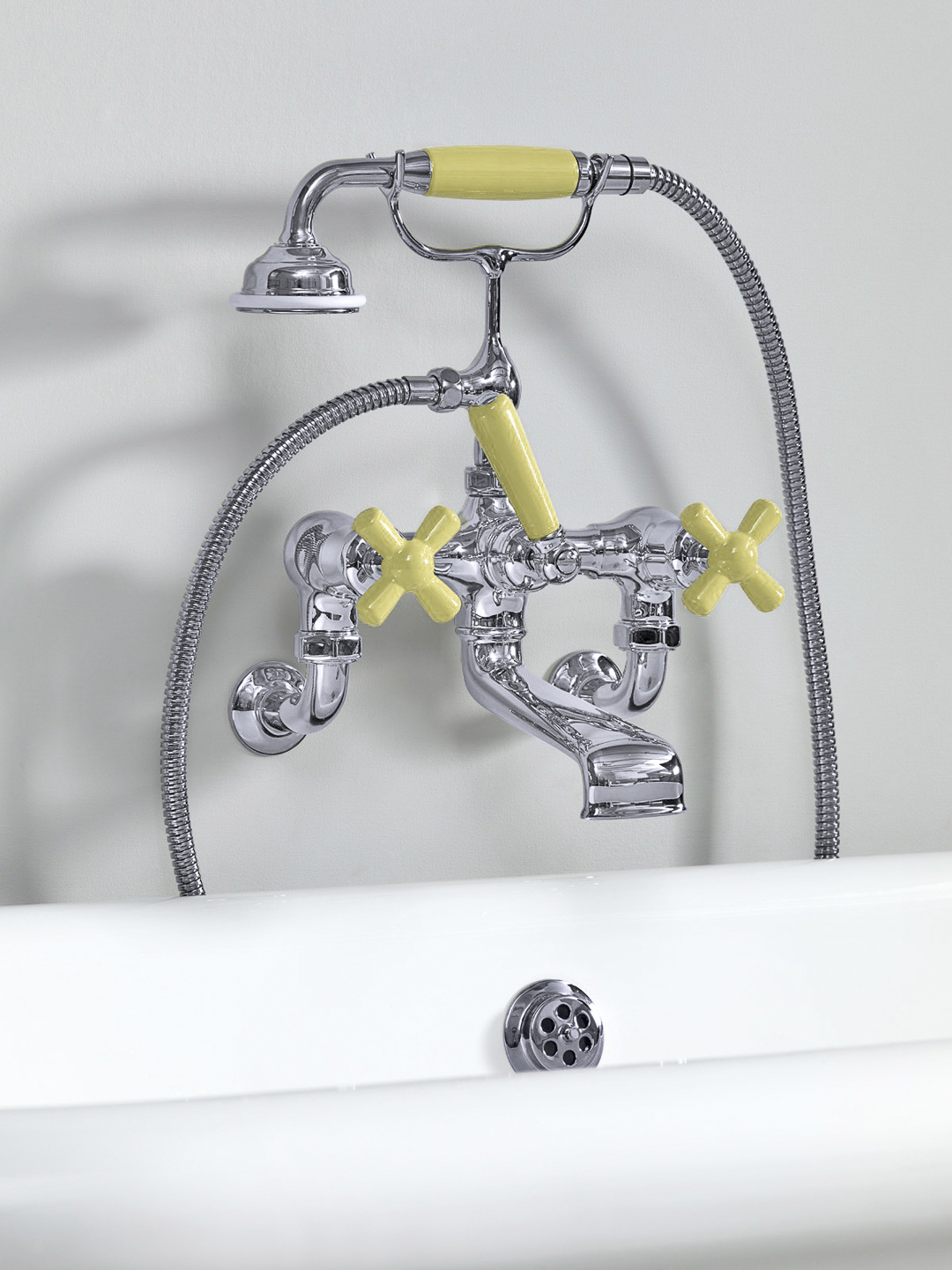 Rockwell wall-mounted bath mixer with handshower & metal/coloured crosshead taps