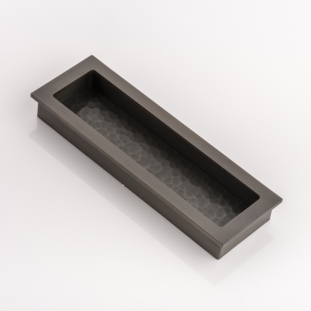 Rectangular solid brass recessed pull with hammered texture