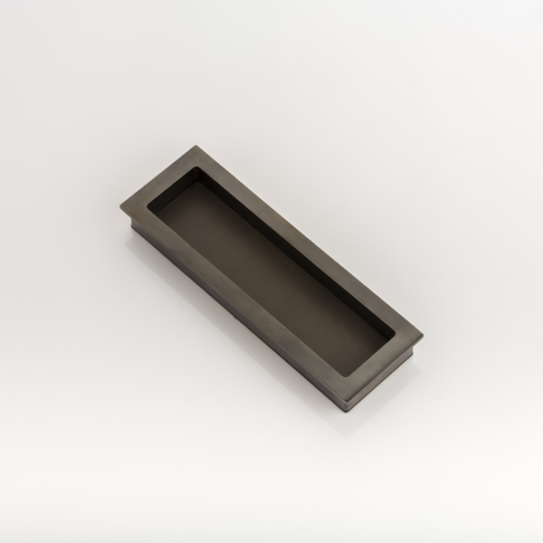 Rectangular solid brass recessed pull with bridle leather
