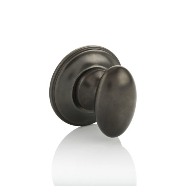 Oval thumb turn with traditional rose