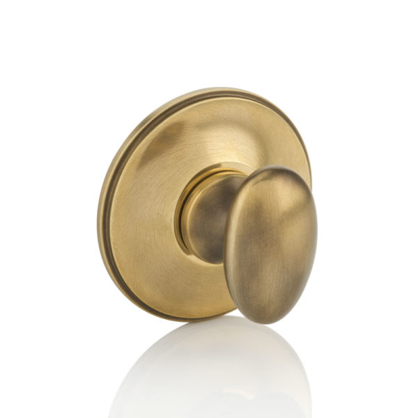 Oval thumb turn with traditional rose