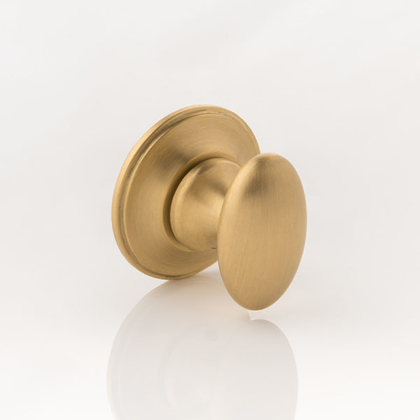 Oval thumb turn with traditional rose