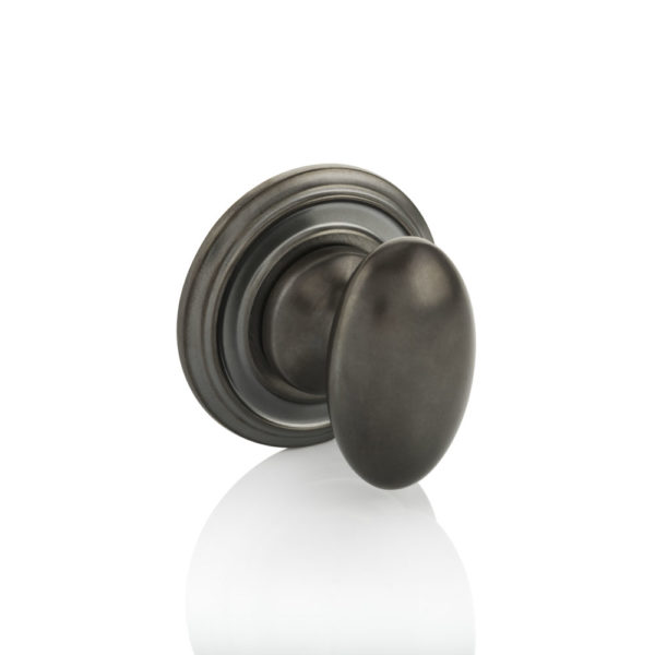 Oval thumb turn with ornate rose