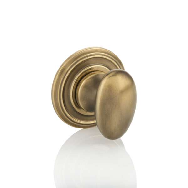 Oval thumb turn with ornate rose