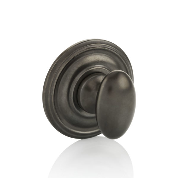 Oval thumb turn with ornate rose