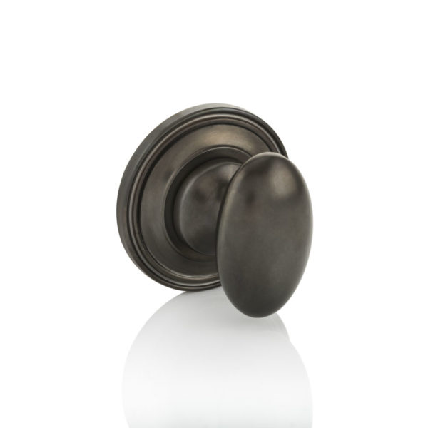 Oval thumb turn with ridged rose